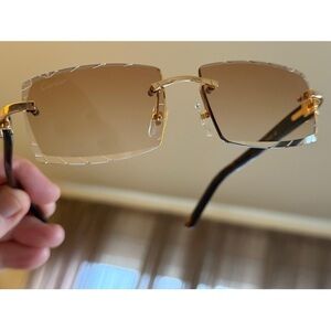 Cartier Gold and Brown Rimless Sunglasses.